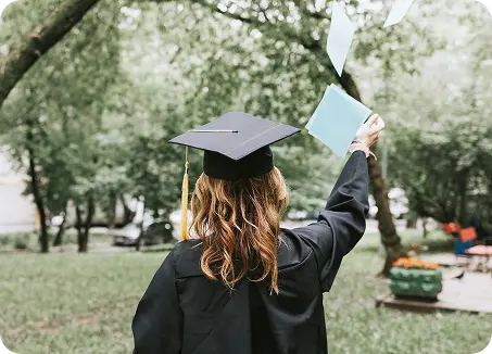 smiling with joy at her achievement